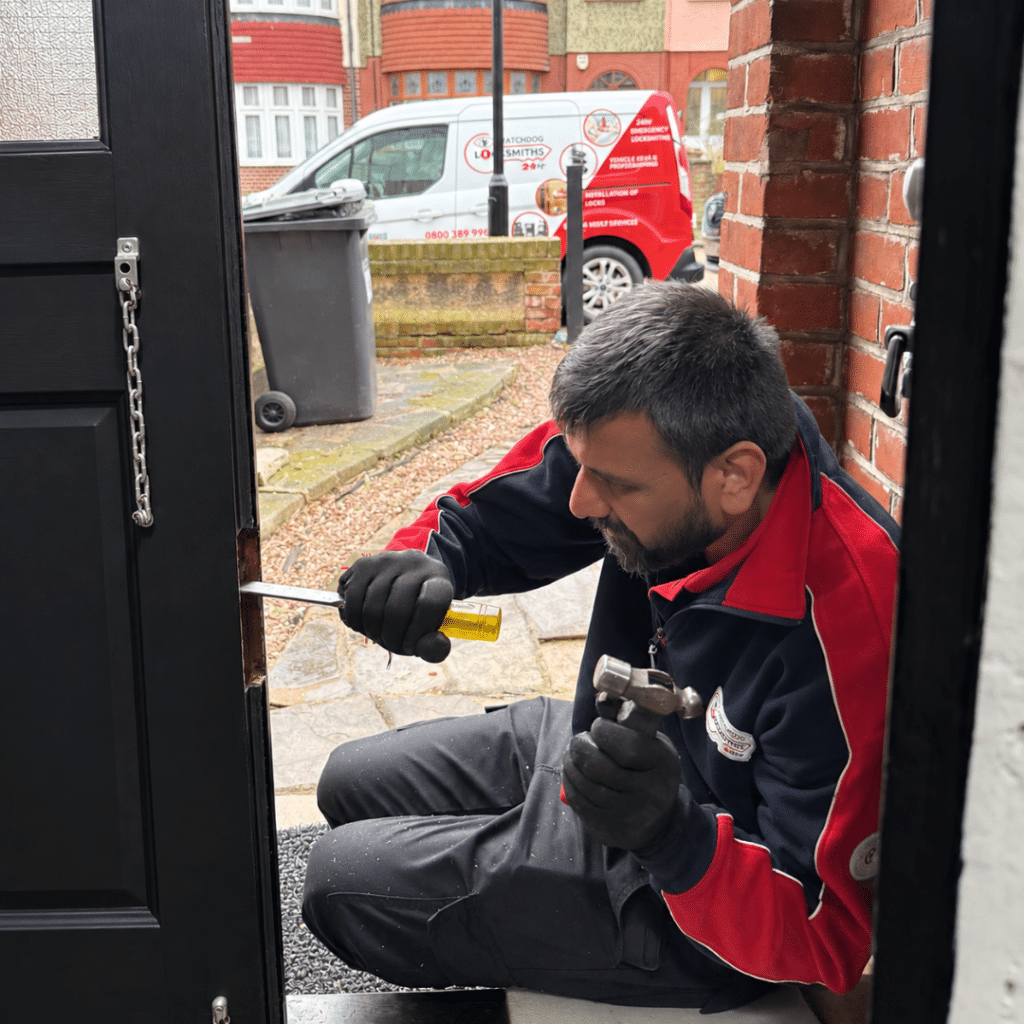 a greenford locksmith fixing a door